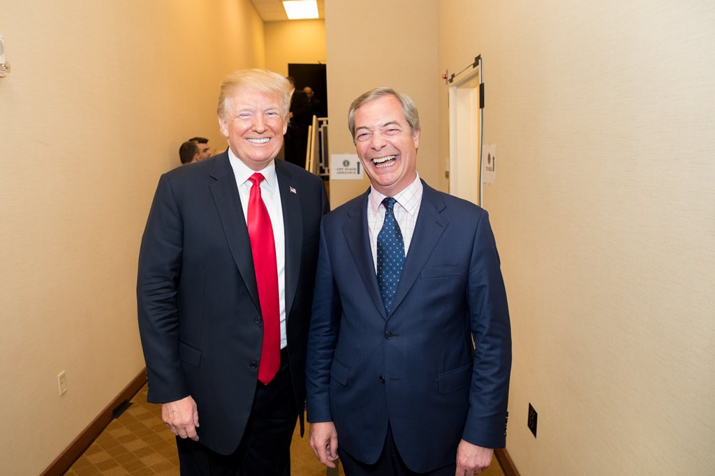 Nigel Farage smiling backstage at CPAC in February 2018